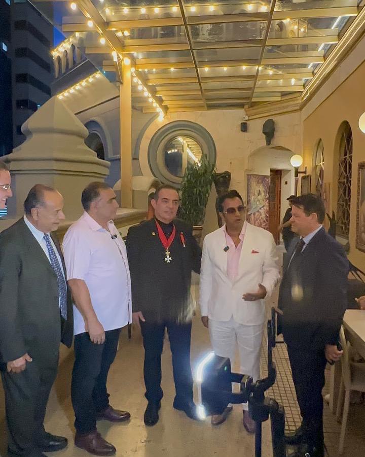 Dr Alrashid with guests and hosts at the evening reception following the presentation